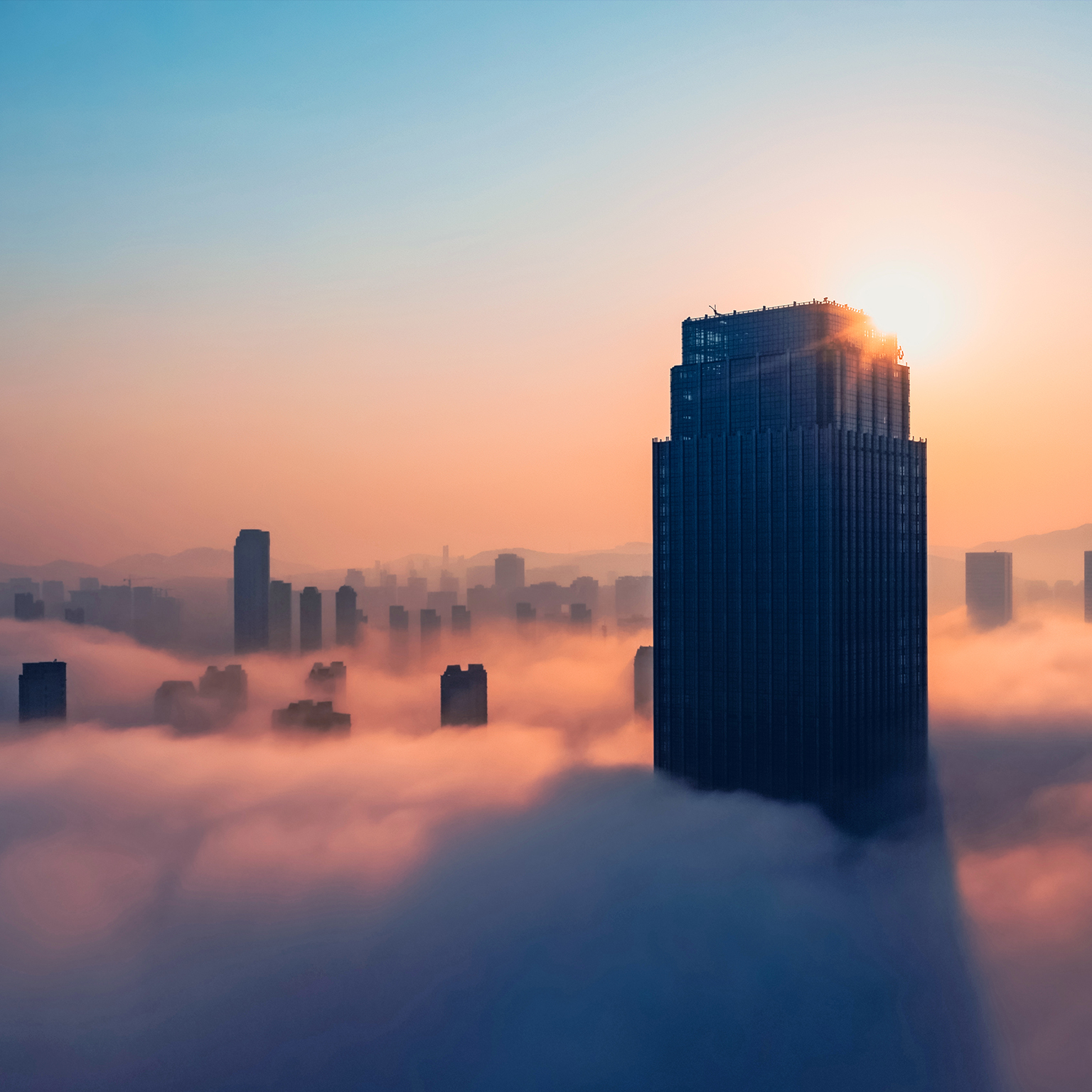 Aerial view of office building in cloud. - stock photo
